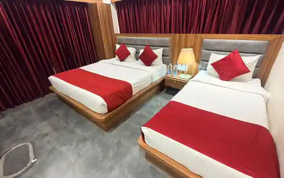 Triple bed room with double and single bed at Hotel Maruti R Ambli Bopal, Ahmedabad