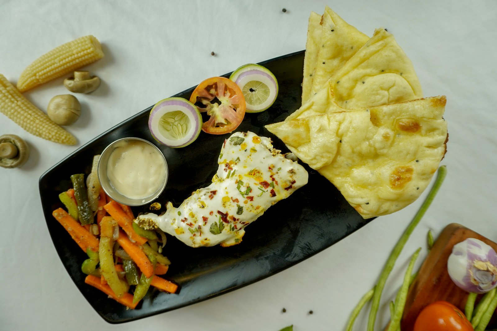 Punjabi paneer platter with naan, vegetables and sauce at Maruti R Restaurant & Cafe